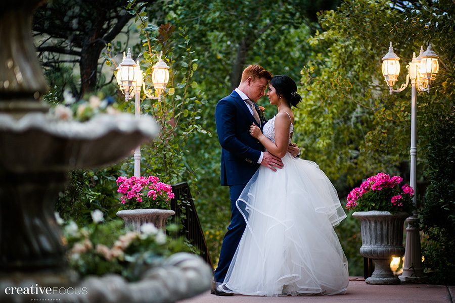 bride and groom wedding photo in beautiful fountain courtyard